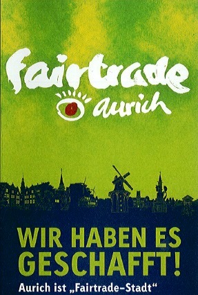 Werbeplakat Fairtrade Aurich "Wir haben es geschafft! Aurich ist Fairtrade-Stadt.